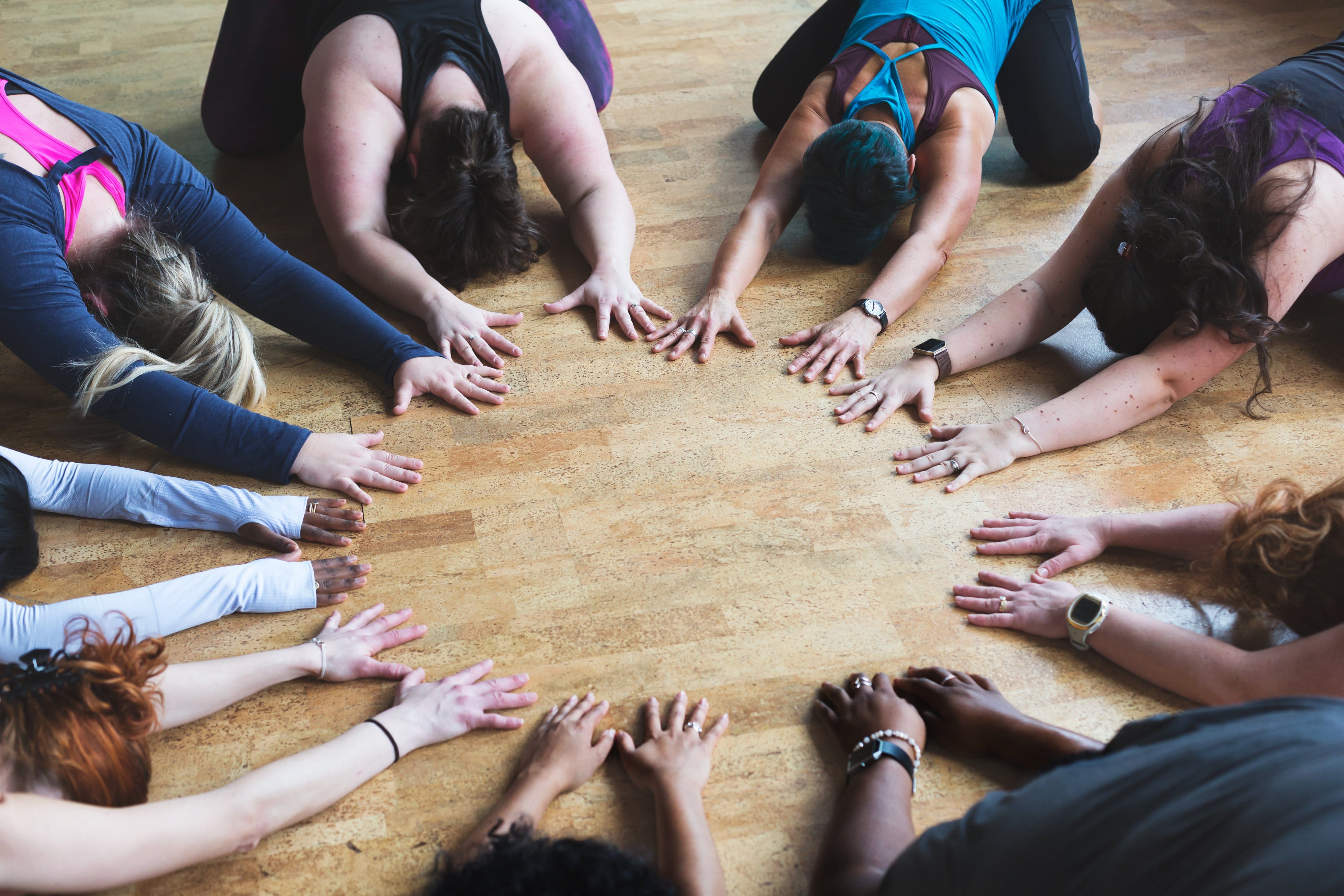 ladies stretching in circle